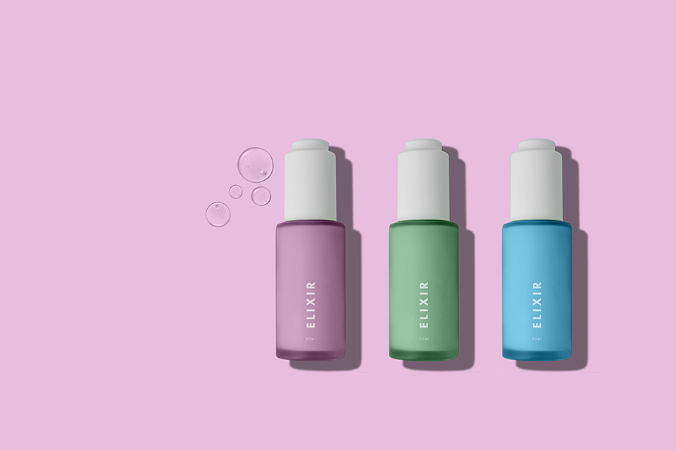 Elixir bottles on pink background