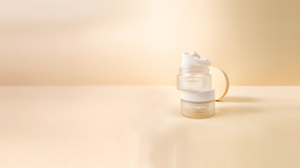 two refillable jars on a beige background