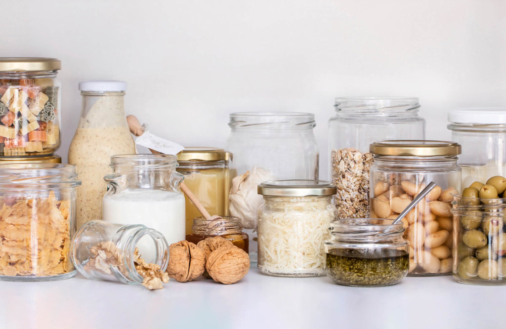 Variety of jars and bottles filled with sauces, dairy products and dry products