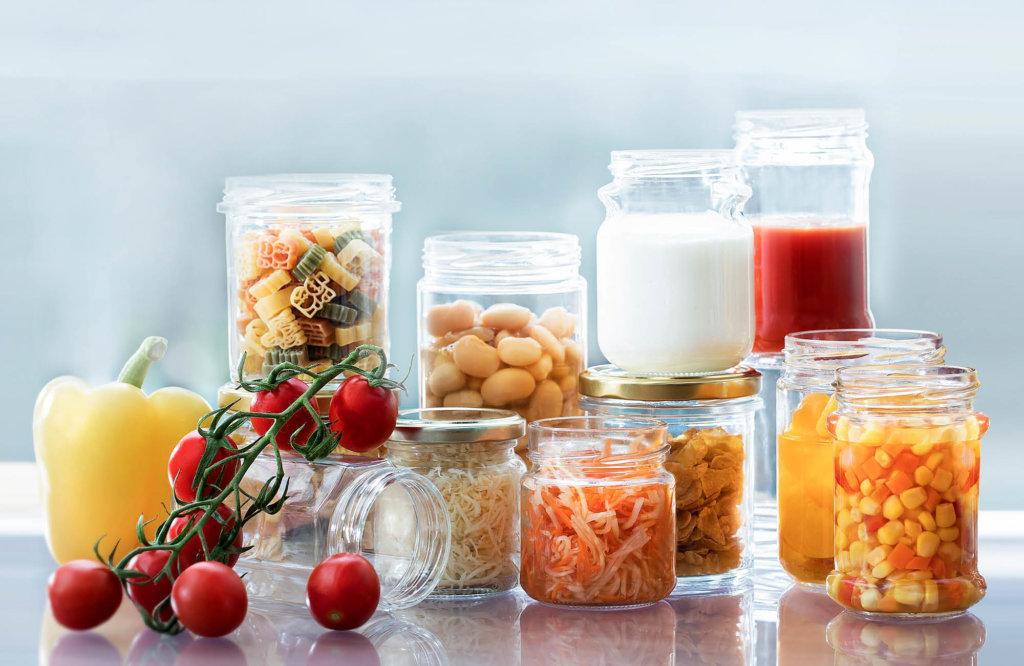 Glass jars filled with different food products