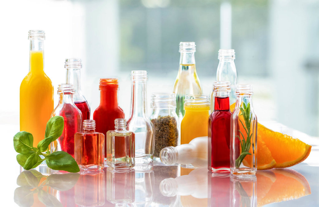 Glass bottles filled with different food products