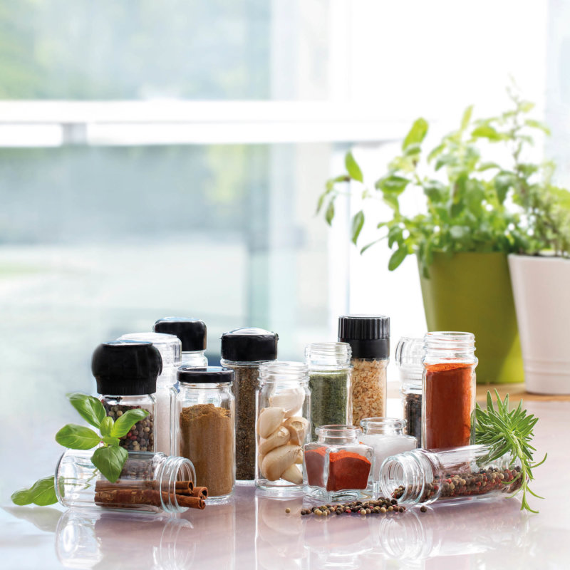 Selection of filled spice jars on a table