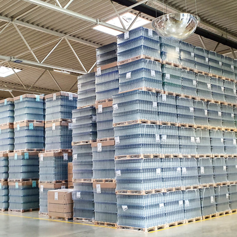 Pallets of flint glass jars in the warehouse