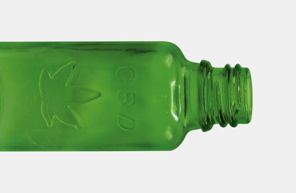 Green embossed bottle with hemp leaf