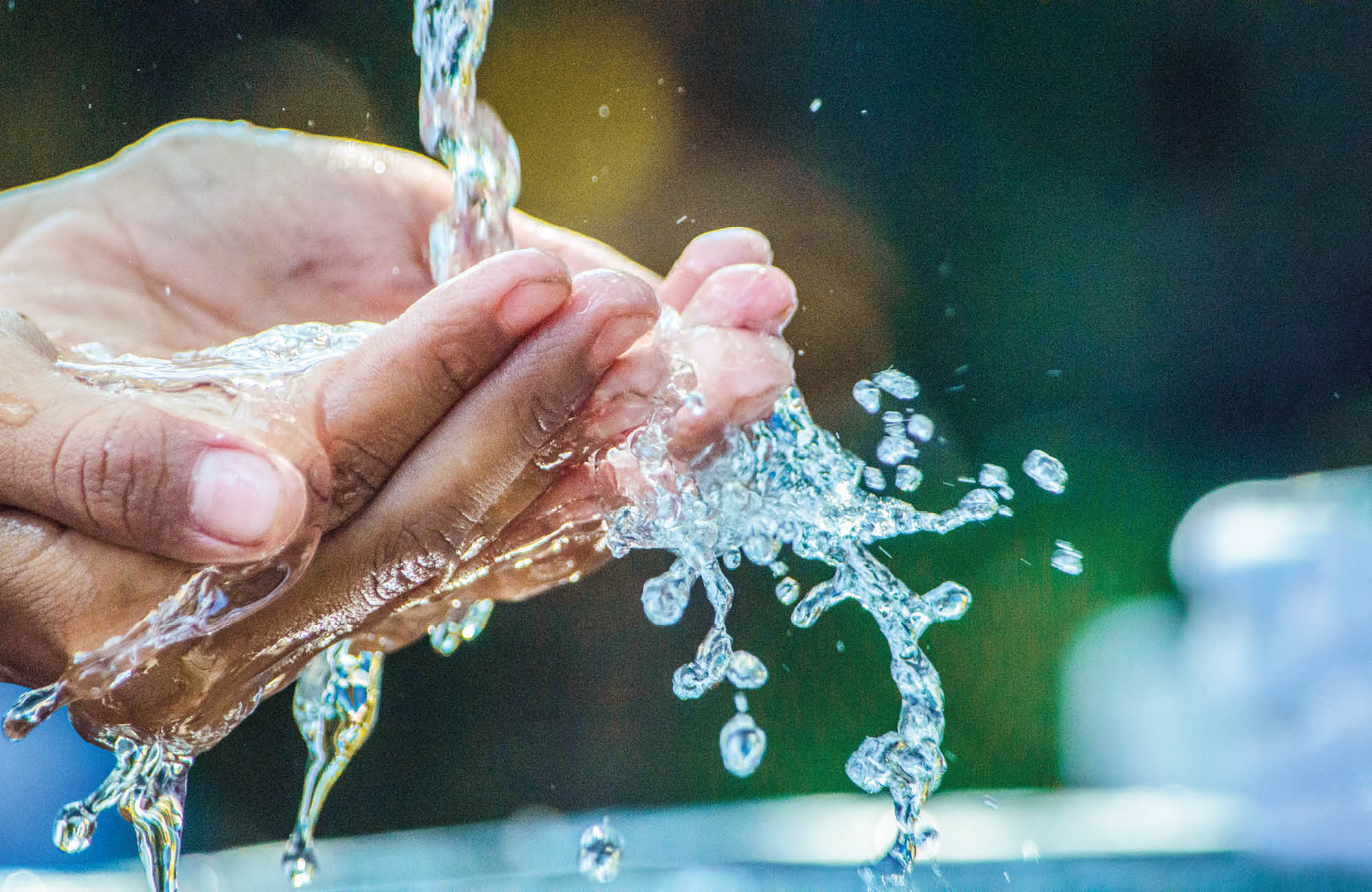 A person holds water in hands