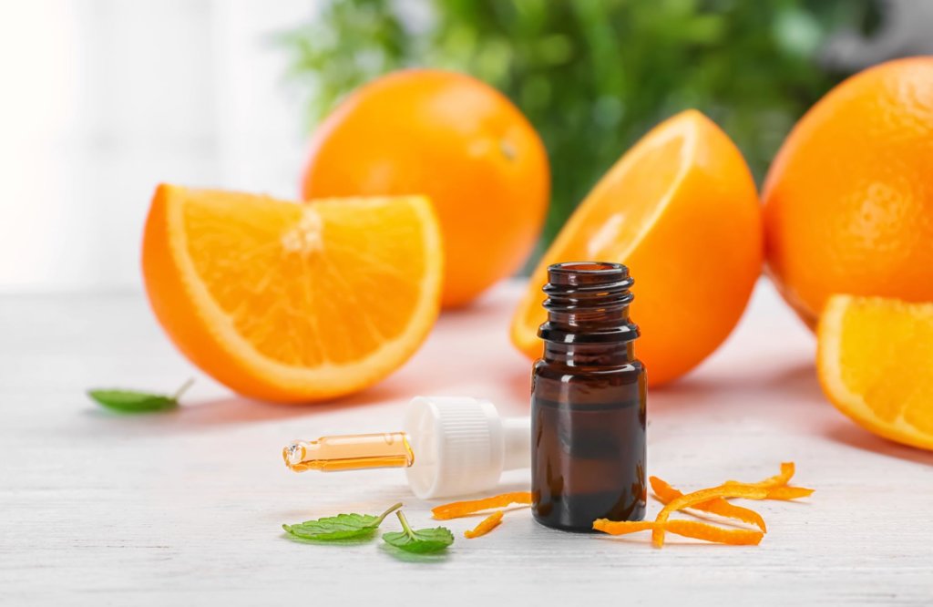 Essential oils with oranges and pipette