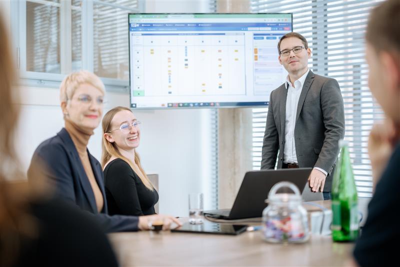 Stoelzle Flaconnage employees sit in a group