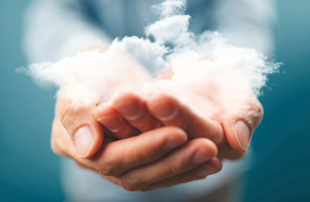 Hand holding a cloud of smoke